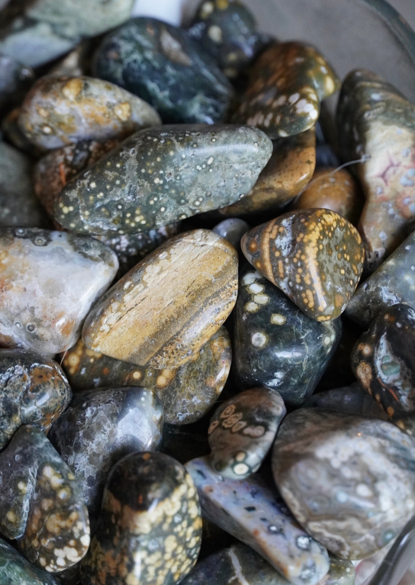 Old stock green, yellow, blue and white colored 7th vein ocean jasper tumbles