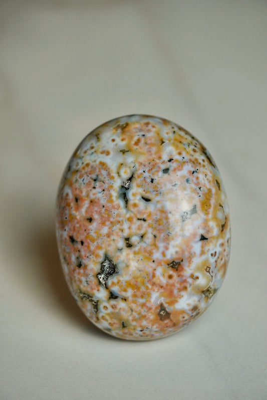 8th vein ocean jasper druzy with peachy orbing 