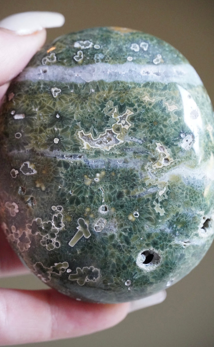 Green plume 7th vein palm stone with quartz/silica inclusions