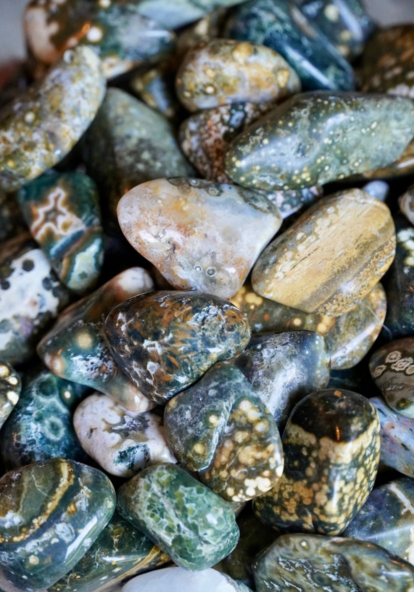 Old stock green, yellow, blue and white colored 7th vein ocean jasper tumbles 