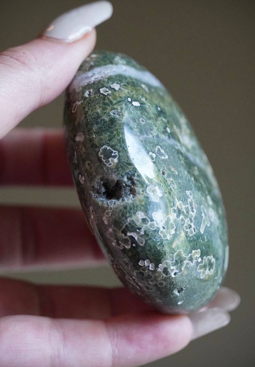 Green plume 7th vein palm stone with quartz/silica inclusions and druzy